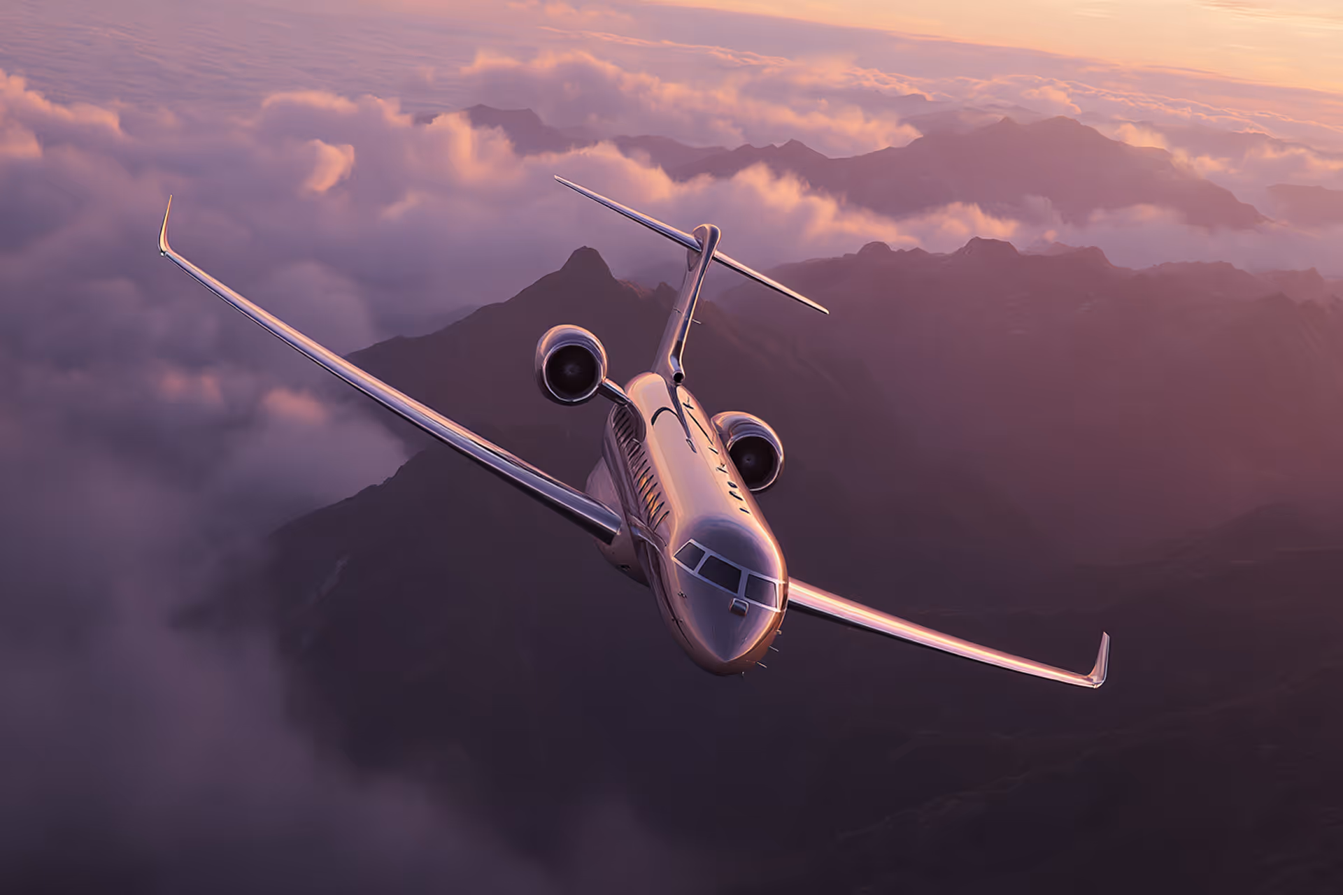 Private jet flying above mountains and clouds during a pink and purple sunset.